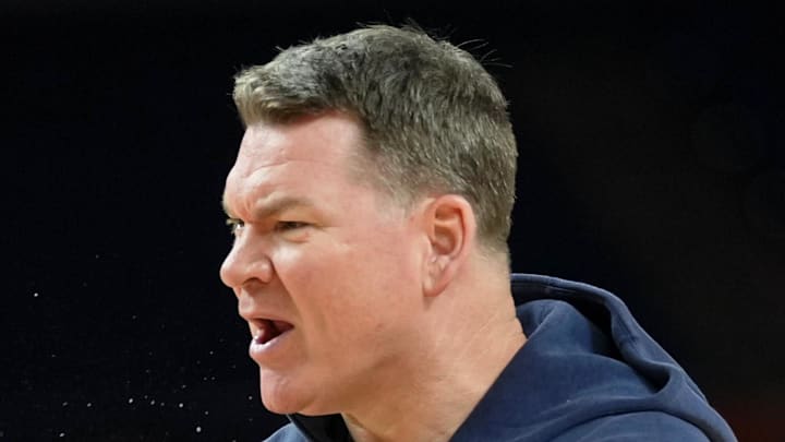 Apr 3, 2026; Indianapolis, IN, USA; Arizona Wildcats head coach Tommy Lloyd directs players during a practice session ahead of the Final Four of the men's 2026 NCAA Tournament at Lucas Oil Stadium. Mandatory Credit: Robert Deutsch-Imagn Images Apr 3, 2026; Indianapolis, IN, USA; Arizona Wildcats head coach Tommy Lloyd directs players during a practice session ahead of the Final Four of the men's 2026 NCAA Tournament at Lucas Oil Stadium. Mandatory Credit: Robert Deutsch-Imagn Images