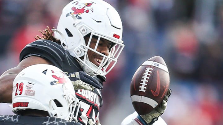Louisville Cardinals linebacker TJ Quinn celebrates an interception against Virginia Tech in 2023. Louisville Cardinals linebacker TJ Quinn celebrates an interception against Virginia Tech in 2023.