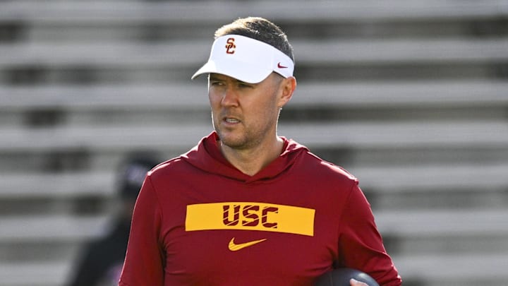 Oct 19, 2024; College Park, Maryland, USA;  Southern California Trojans head coach Lincoln Riley stands on the field before the game against the Maryland Terrapins at SECU Stadium. Mandatory Credit: Tommy Gilligan-Imagn Images