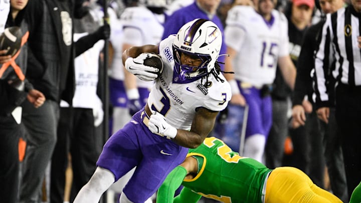Dec 20, 2025; Eugene, OR, USA; James Madison Dukes running back Wayne Knight (3) rushes during the second quarter against the Oregon Ducks at Autzen Stadium. Mandatory Credit: Troy Wayrynen-Imagn Images