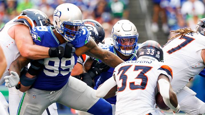 Sep 8, 2024; Seattle, Washington, USA; Seattle Seahawks defensive end Leonard Williams (99) and Seattle Seahawks defensive tackle Byron Murphy II (91) tackle Denver Broncos running back Javonte Williams (33) for a loss during the fourth quarter at Lumen Field. Mandatory Credit: Joe Nicholson-Imagn Images Sep 8, 2024; Seattle, Washington, USA; Seattle Seahawks defensive end Leonard Williams (99) and Seattle Seahawks defensive tackle Byron Murphy II (91) tackle Denver Broncos running back Javonte Williams (33) for a loss during the fourth quarter at Lumen Field. Mandatory Credit: Joe Nicholson-Imagn Images