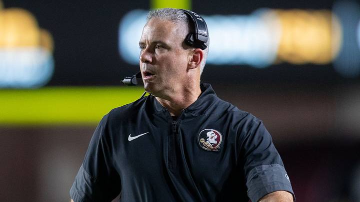 Florida State Seminoles head coach Mike Norvell talks into his headset during a timeout. The Florida State Seminoles defeated the New Mexico State Aggies 34-17 at Doak Campbell Stadium on Saturday, Aug. 29, 2026.