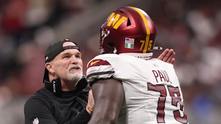 Washington Commanders head coach Dan Quinn and offensive lineman Chris Paul. 
