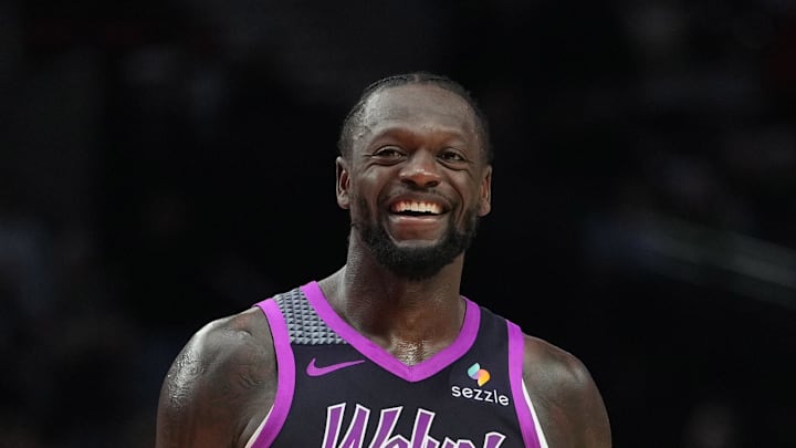 Feb 24, 2026; Portland, Oregon, USA; Minnesota Timberwolves forward Julius Randle (30) and Portland Trail Blazers guard Jrue Holiday (5) share a laugh during the second half at Moda Center. Mandatory Credit: Soobum Im-Imagn Images