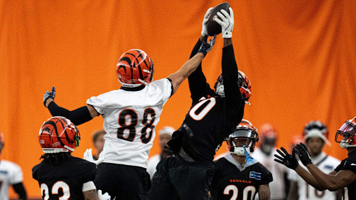 Cincinnati Bengals linebacker Shaka Heyward (50) intercepts a pass intended for Cincinnati Bengals tight end Mike Gesicki (88) at Bengals spring practice at the IEL Indoor Facility in Cincinnati on Wednesday, June 12, 2024. Cincinnati Bengals linebacker Shaka Heyward (50) intercepts a pass intended for Cincinnati Bengals tight end Mike Gesicki (88) at Bengals spring practice at the IEL Indoor Facility in Cincinnati on Wednesday, June 12, 2024.