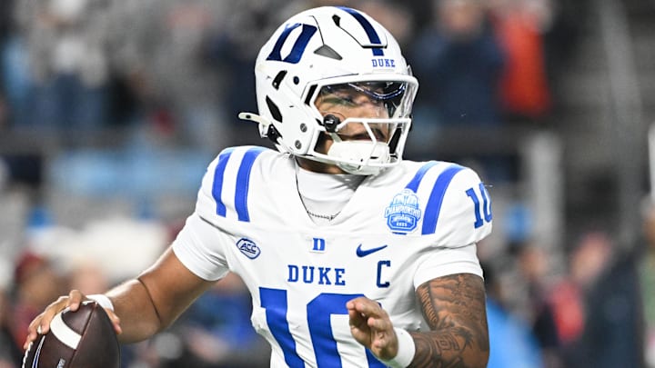 Dec 6, 2025; Charlotte, NC, USA; Duke Blue Devils quarterback Darian Mensah (10) looks to throw in the second quarter against the Virginia Cavaliers during the 2025 ACC Championship game at Bank of America Stadium. Mandatory Credit: Bob Donnan-Imagn Images