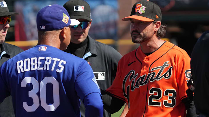 Feb 27, 2026; Scottsdale, Arizona, USA; Los Angeles Dodgers manager Dave Roberts (30) talks to San Francisco Giants manager Tony Vitello (23) before a game at Scottsdale Stadium. Mandatory Credit: Rick Scuteri-Imagn Images