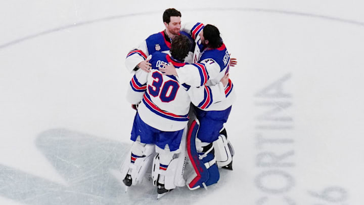 [US, Mexico & Canada customers only] Feb 22, 2026; Milan, Italy; Connor Hellebuyck (37) of the United States, Jake Oettinger (30) of the United States and Jeremy Swayman (1) of the United States celebrate after defeating Canada in the men's ice hockey gold medal game during the Milano Cortina 2026 Olympic Winter Games at Milano Santagiulia Ice Hockey Arena. Mandatory Credit: Mike Segar/Reuters via Imagn Images
