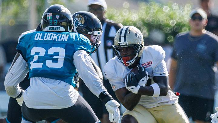 Aug 13, 2026; Metairie, LA, USA; New Orleans Saints running back Travis Etienne Jr. (3) runs against Jacksonville Jaguars linebacker Foyesade Oluokun (23) during a joint scrimmage during at Ochsner Sports Performance Center. Mandatory Credit: Stephen Lew-Imagn Images Aug 13, 2026; Metairie, LA, USA; New Orleans Saints running back Travis Etienne Jr. (3) runs against Jacksonville Jaguars linebacker Foyesade Oluokun (23) during a joint scrimmage during at Ochsner Sports Performance Center. Mandatory Credit: Stephen Lew-Imagn Images
