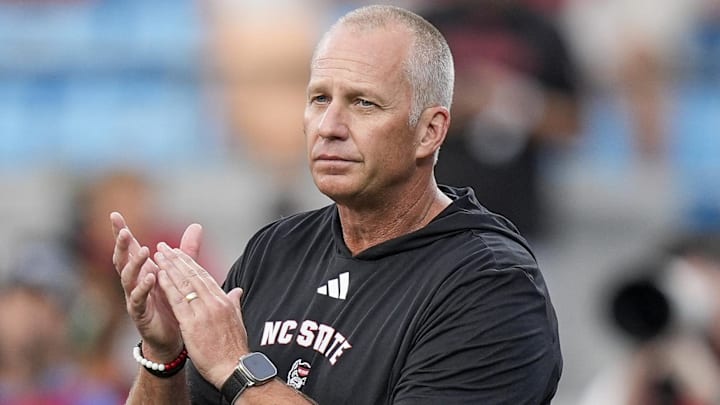 Sep 7, 2024; Charlotte, North Carolina, USA; North Carolina State Wolfpack head coach Dave Doeren during pregame activities against the Tennessee Volunteers at the Dukes Mayo Classic at Bank of America Stadium. Mandatory Credit: Jim Dedmon-Imagn Images