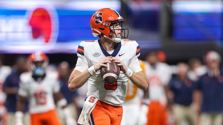 Aug 30, 2025; Atlanta, Georgia, USA; Syracuse Orange quarterback Steve Angeli (9) looks for an open receiver against the Tennessee Volunteers in the third quarter at Mercedes-Benz Stadium. Mandatory Credit: Brett Davis-Imagn Images Aug 30, 2025; Atlanta, Georgia, USA; Syracuse Orange quarterback Steve Angeli (9) looks for an open receiver against the Tennessee Volunteers in the third quarter at Mercedes-Benz Stadium. Mandatory Credit: Brett Davis-Imagn Images