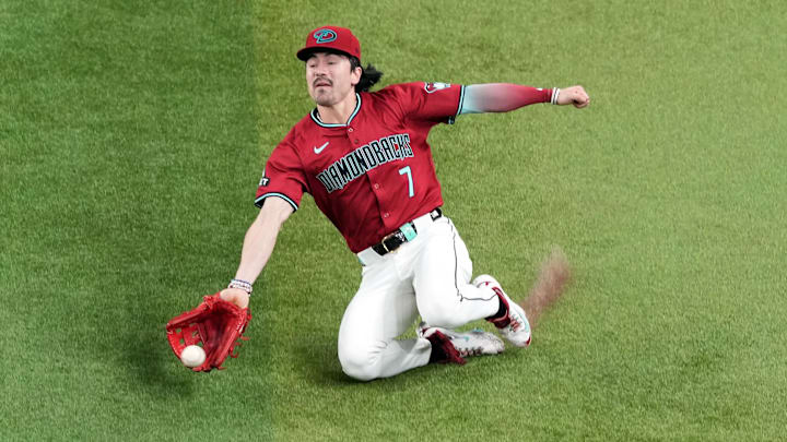 Sep 28, 2024; Phoenix, Arizona, USA; Arizona Diamondbacks outfielder Corbin Carroll (7) is unable to make a sliding catch against the San Diego Padres during the third inning at Chase Field. Mandatory Credit: Joe Camporeale-Imagn Images Sep 28, 2024; Phoenix, Arizona, USA; Arizona Diamondbacks outfielder Corbin Carroll (7) is unable to make a sliding catch against the San Diego Padres during the third inning at Chase Field. Mandatory Credit: Joe Camporeale-Imagn Images