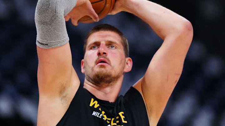 Apr 29, 2025; Denver, Colorado, USA; Denver Nuggets center Nikola Jokic (15) warms up before game five of the first round for the 2025 NBA Playoffs against the LA Clippers at Ball Arena. Mandatory Credit: Ron Chenoy-Imagn Images