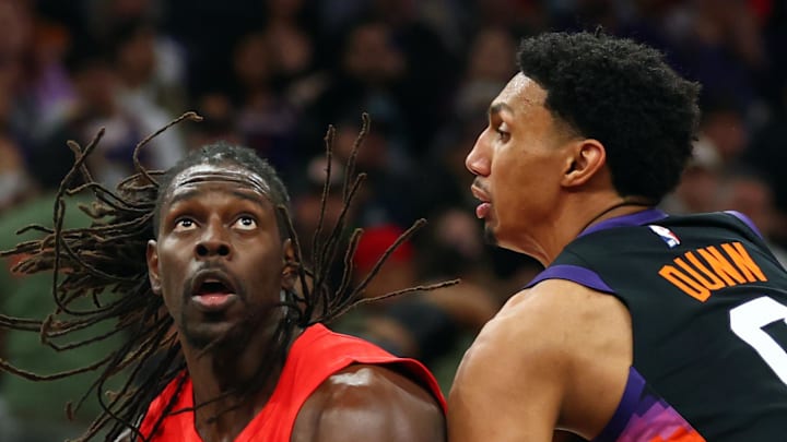 Portland Trail Blazers guard Jrue Holiday drives to the basket against Phoenix Suns forward Ryan Dunn.