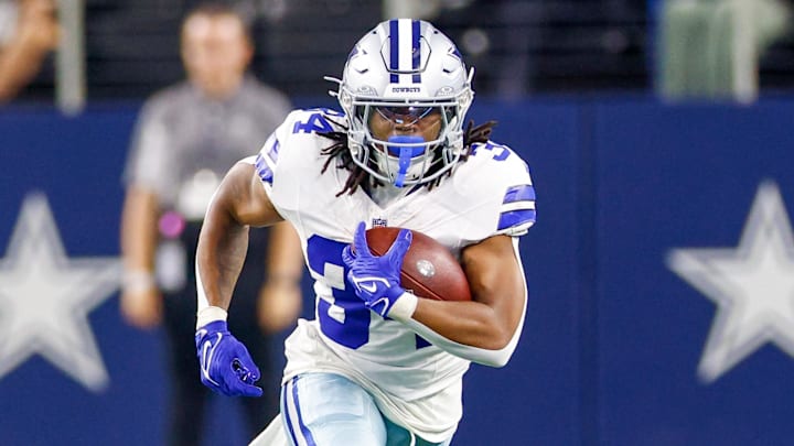 Dallas Cowboys running back Jaydon Blue carries the ball during the fourth quarter against the Atlanta Falcons 