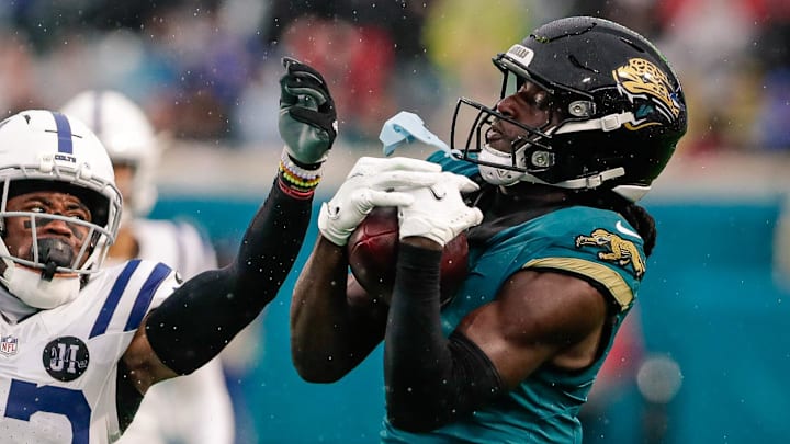Dec 7, 2025; Jacksonville, Florida, USA; Jacksonville Jaguars wide receiver Brian Thomas Jr. (7) catches a pass over Indianapolis Colts cornerback Kenny Moore II (23) at EverBank Stadium. Dec 7, 2025; Jacksonville, Florida, USA; Jacksonville Jaguars wide receiver Brian Thomas Jr. (7) catches a pass over Indianapolis Colts cornerback Kenny Moore II (23) at EverBank Stadium.