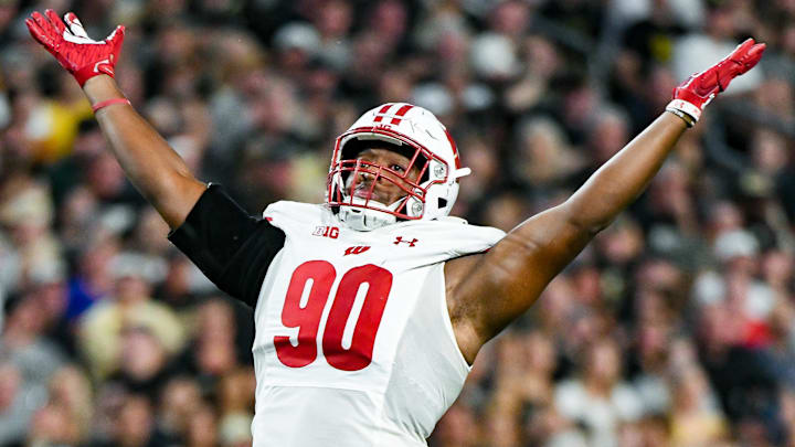 Wisconsin Badgers defensive end James Thompson Jr. (90) celebrates after sacking the Purdue Boilermakers quarterback in West Lafayette, Ind., on Sept. 22, 2023.