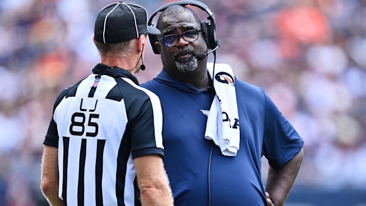 New Patriots defensive coordinator Terrell Williams talks with Line Judge Daniel Gallagher (85) at Soldier Field.