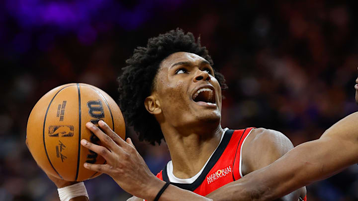 Jan 16, 2025; Sacramento, California, USA; Houston Rockets forward Amen Thompson (1) controls the ball against Sacramento Kings guard De'Aaron Fox (5) during the fourth quarter at Golden 1 Center. Mandatory Credit: Sergio Estrada-Imagn Images