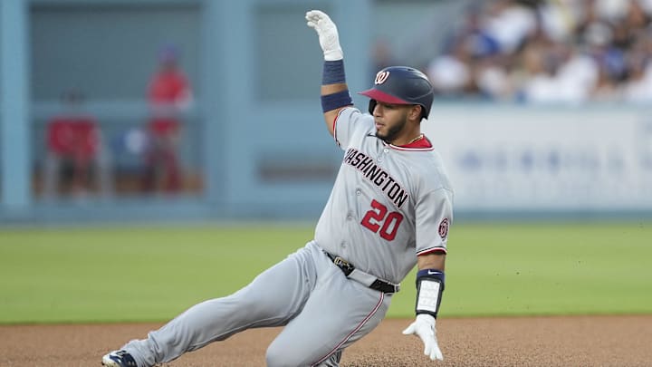 Jun 21, 2025; Los Angeles, California, USA; Washington Nationals catcher Keibert Ruiz (20) doubles in the third inning against the Los Angeles Dodgers at Dodger Stadium. Jun 21, 2025; Los Angeles, California, USA; Washington Nationals catcher Keibert Ruiz (20) doubles in the third inning against the Los Angeles Dodgers at Dodger Stadium.