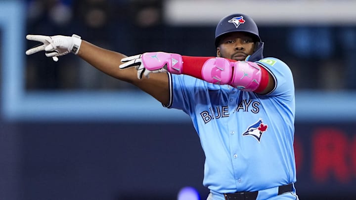 Mar 31, 2025; Toronto, Ontario, CAN; Toronto Blue Jays first baseman Vladimir Guerrero Jr. (27) celebrates hitting a double against the Washington Nationals during the second inning at Rogers Centre. Mar 31, 2025; Toronto, Ontario, CAN; Toronto Blue Jays first baseman Vladimir Guerrero Jr. (27) celebrates hitting a double against the Washington Nationals during the second inning at Rogers Centre.