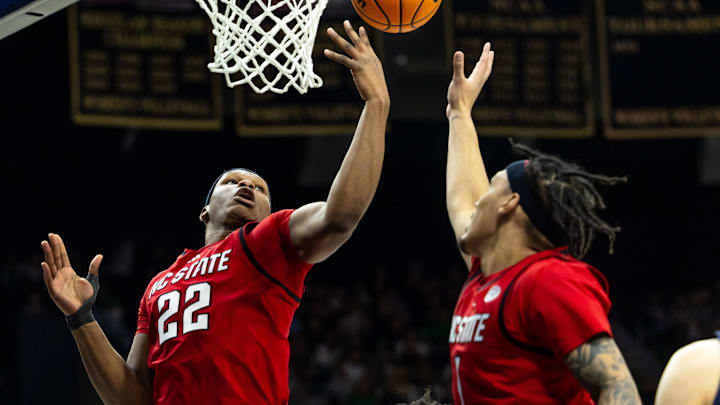 Feb 28, 2026; South Bend, Indiana, USA; NC State Wolfpack forward Ven-Allen Lubin (22) and forward Darrion Williams (1) go for a rebound against the Notre Dame Fighting Irish during the first half at Purcell Pavilion at the Joyce Center. Mandatory Credit: Michael Caterina-Imagn Images