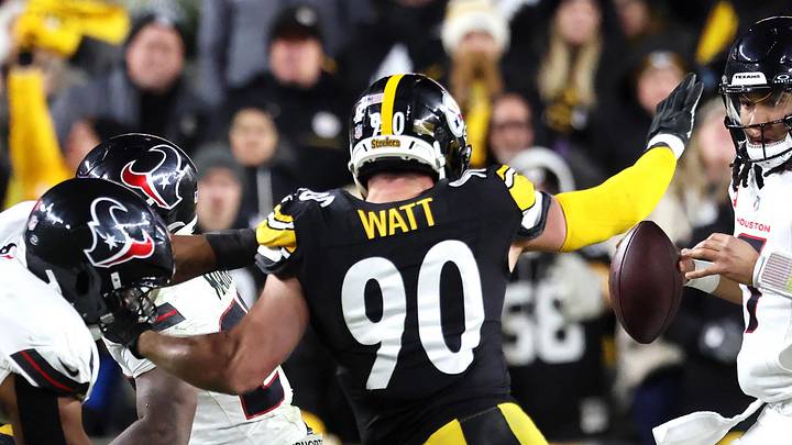 Jan 12, 2026; Pittsburgh, PA, USA; Houston Texans quarterback C.J. Stroud (7) scrambles against Pittsburgh Steelers linebacker T.J. Watt (90) during the second half of an AFC Wild Card Round game at Acrisure Stadium. Mandatory Credit: Charles LeClaire-Imagn Images
