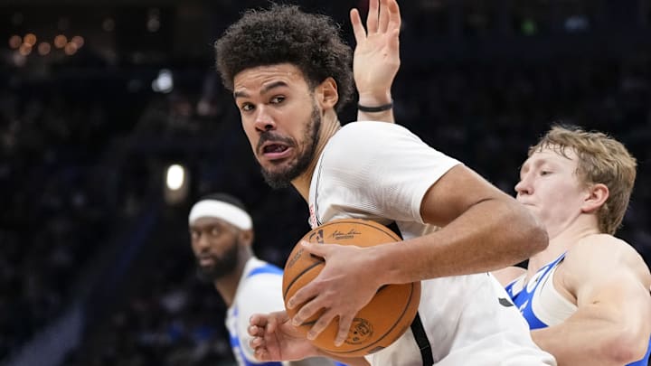 Dec 26, 2024; Milwaukee, Wisconsin, USA;  Brooklyn Nets forward Cameron Johnson (2) spins towards the basket around Milwaukee Bucks guard AJ Green (20) during the fourth quarter at Fiserv Forum. Mandatory Credit: Jeff Hanisch-Imagn Images