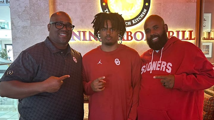 Oklahoma defensive tackles coach Todd Bates and commit Elija Harmon.