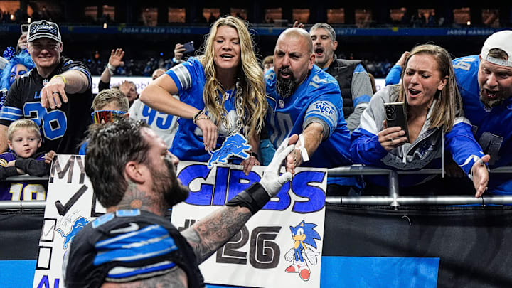Detroit Lions offensive tackle Taylor Decker (68) high-fives fans after 31-9 win over Minnesota Vikings at Ford Field 