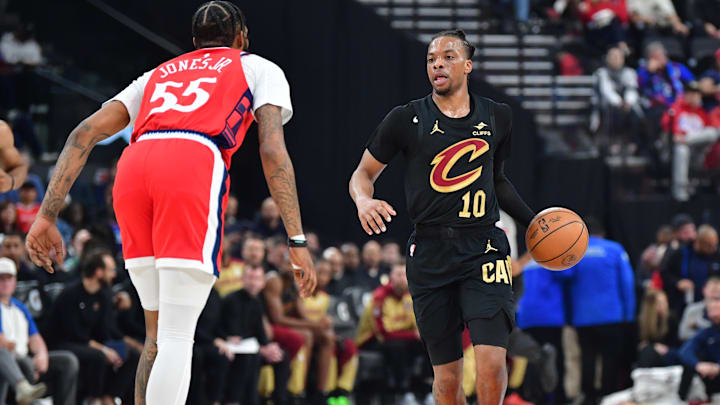 Mar 18, 2025; Inglewood, California, USA;  Cleveland Cavaliers guard Darius Garland (10) moves the ball against Los Angeles Clippers forward Derrick Jones Jr. (55) during the first half at Intuit Dome. Mandatory Credit: Gary A. Vasquez-Imagn Images