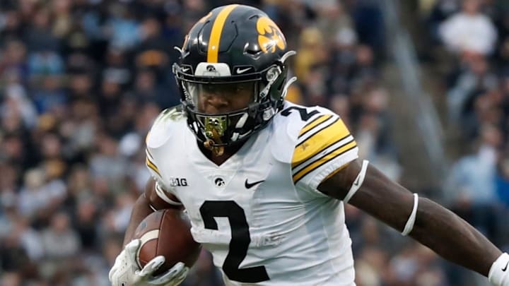 Iowa Hawkeyes running back Kaleb Johnson (2) stiff arms Purdue Boilermakers linebacker Semisi Fakasiieiki (97) during the NCAA football game, Saturday, Nov. 5, 2022, at Ross-Ade Stadium in West Lafayette, Ind. Iowa won 24-3. Iowa Hawkeyes running back Kaleb Johnson (2) stiff arms Purdue Boilermakers linebacker Semisi Fakasiieiki (97) during the NCAA football game, Saturday, Nov. 5, 2022, at Ross-Ade Stadium in West Lafayette, Ind. Iowa won 24-3.