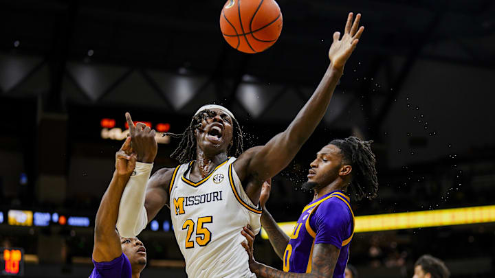 Jan 7, 2025; Columbia, Missouri, USA; Missouri Tigers guard Mark Mitchell (25) loses control of the ball against LSU Tigers guard Jordan Sears (1) and forward Daimion Collins (10) during the first half at Mizzou Arena. Mandatory Credit: Jay Biggerstaff-Imagn Images Jan 7, 2025; Columbia, Missouri, USA; Missouri Tigers guard Mark Mitchell (25) loses control of the ball against LSU Tigers guard Jordan Sears (1) and forward Daimion Collins (10) during the first half at Mizzou Arena. Mandatory Credit: Jay Biggerstaff-Imagn Images