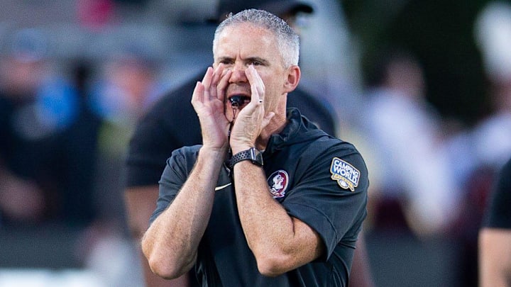 Florida State Seminoles head coach Mike Norvell leads warmups before the Seminoles take on the LSU Tigers on Sunday, Sept. 3, 2023 at Camping World Stadium.
