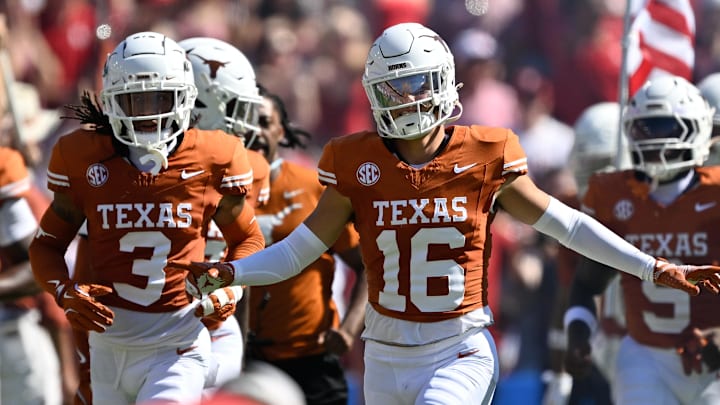 Texas Longhorns defensive back Michael Taaffe leads the team on to the field against the Oklahoma Sooners 