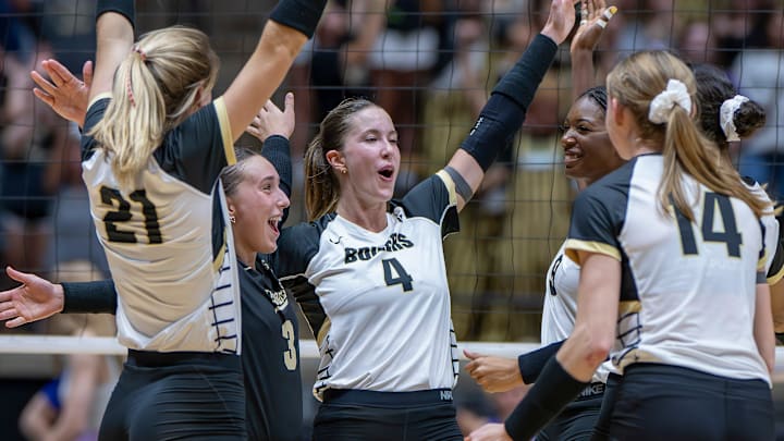 Purdue Junior Kenna Wollard (4) and her squad celebrate the win 