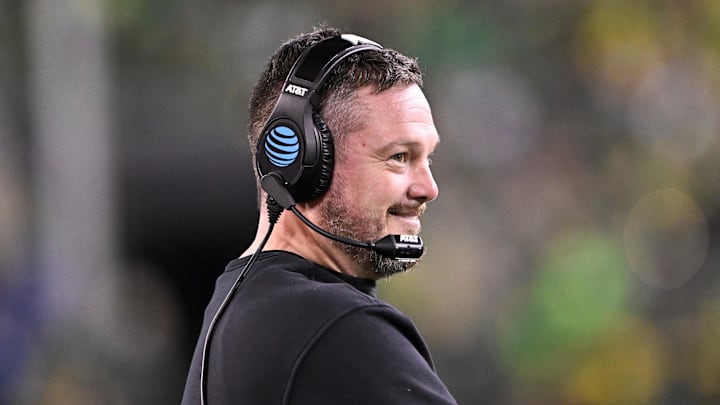 Dec 20, 2025; Eugene, OR, USA;  Oregon Ducks head coach Dan Lanning smiles during the third quarter against the James Madison Dukes at Autzen Stadium. 