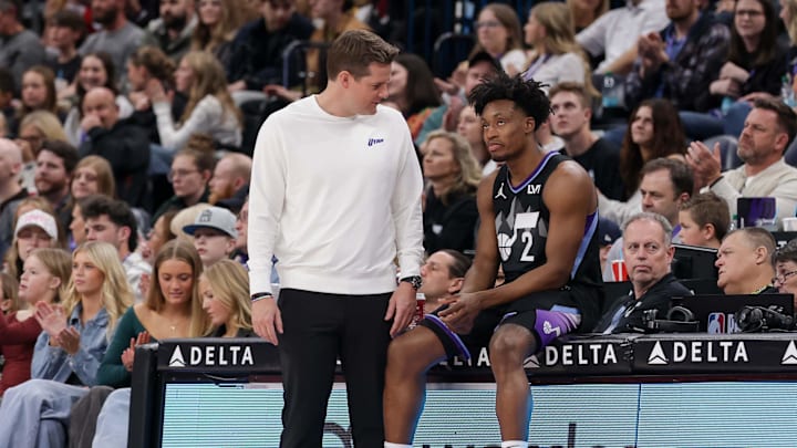 Mar 14, 2025; Salt Lake City, Utah, USA;  Utah Jazz head coach Will Hardy talks with Utah Jazz guard Collin Sexton (2) during  stoppage in play against the Toronto Raptors at Delta Center. Mandatory Credit: Chris Nicoll-Imagn Images
