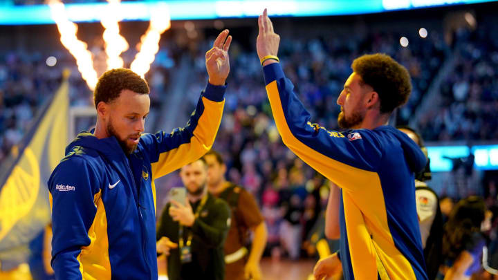 Nov 1, 2023; San Francisco, California, USA; Golden State Warriors guard Stephen Curry (30) exchanges high fives with guard Klay Thompson (11) before the start of the game against the Sacramento Kings at the Chase Center. 