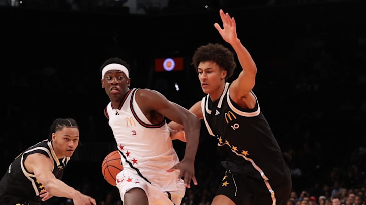 Apr 1, 2025; Brooklyn, NY, USA; McDonald's All American West forward AJ Dybantsa (3) drives to the basket against McDonald's All American East guard Zai Harwell (0) and McDonald's All American East forward Nate Ament (10) during the first half of the game at Barclays Center. Mandatory Credit: Pamela Smith-Imagn Images Apr 1, 2025; Brooklyn, NY, USA; McDonald's All American West forward AJ Dybantsa (3) drives to the basket against McDonald's All American East guard Zai Harwell (0) and McDonald's All American East forward Nate Ament (10) during the first half of the game at Barclays Center. Mandatory Credit: Pamela Smith-Imagn Images