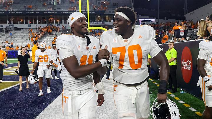 Sep 12, 2026; Atlanta, Georgia, USA; Tennessee Volunteers quarterback Faizon Brandon (11) and offensive lineman David Sanders Jr. (70) celebrate after a victory over the Georgia Tech Yellow Jackets at Bobby Dodd Stadium at Hyundai Field. Mandatory Credit: Brett Davis-Imagn Images Sep 12, 2026; Atlanta, Georgia, USA; Tennessee Volunteers quarterback Faizon Brandon (11) and offensive lineman David Sanders Jr. (70) celebrate after a victory over the Georgia Tech Yellow Jackets at Bobby Dodd Stadium at Hyundai Field. Mandatory Credit: Brett Davis-Imagn Images