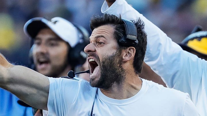 Michigan linebacker coach George Helow reacts to a play against Rutgers during the second half at Michigan Stadium in Ann Arbor on Saturday, Sept. 25, 2021. Michigan linebacker coach George Helow reacts to a play against Rutgers during the second half at Michigan Stadium in Ann Arbor on Saturday, Sept. 25, 2021.