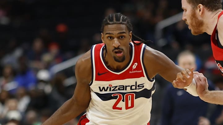 Oct 11, 2024; Washington, District of Columbia, USA; Washington Wizards forward Alex Sarr (20) drives to the basket as Toronto Raptors center Jakob Poeltl (19) in the second quarter at Capital One Arena. Mandatory Credit: Geoff Burke-Imagn Images