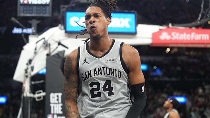 Apr 8, 2026; San Antonio, Texas, USA; San Antonio Spurs guard Devin Vassell (24) reacts after getting fouled while attempting to dunk during the first half against the Portland Trail Blazers at Frost Bank Center. Mandatory Credit: Scott Wachter-Imagn Images