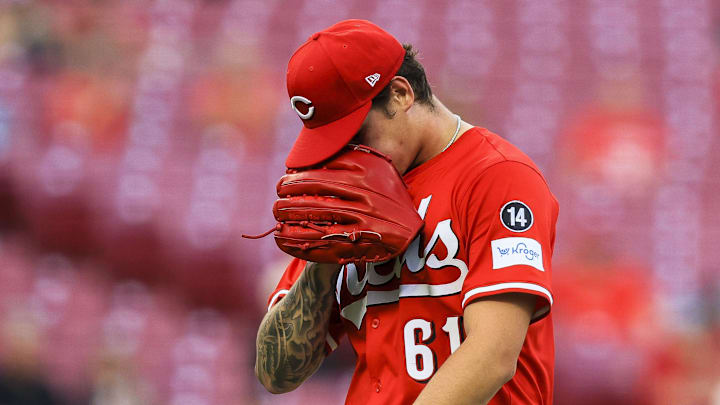 Cincinnati Reds starting pitcher Chase Petty (61) walks off the field