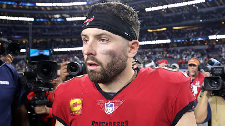 Tampa Bay Buccaneers quarterback Baker Mayfield walks off the field after a game. Tampa Bay Buccaneers quarterback Baker Mayfield walks off the field after a game.