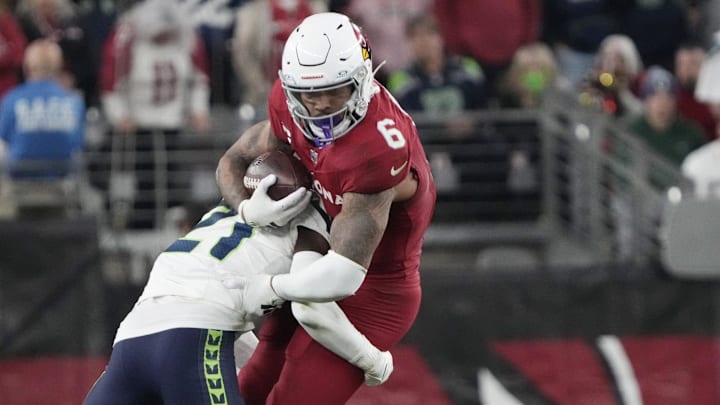 Arizona Cardinals running back James Conner (6) is tackled by Seattle Seahawks cornerback Devon Witherspoon (21) during the fourth quarter at State Farm Stadium in Glendale on Jan. 7, 2024. Arizona Cardinals running back James Conner (6) is tackled by Seattle Seahawks cornerback Devon Witherspoon (21) during the fourth quarter at State Farm Stadium in Glendale on Jan. 7, 2024.