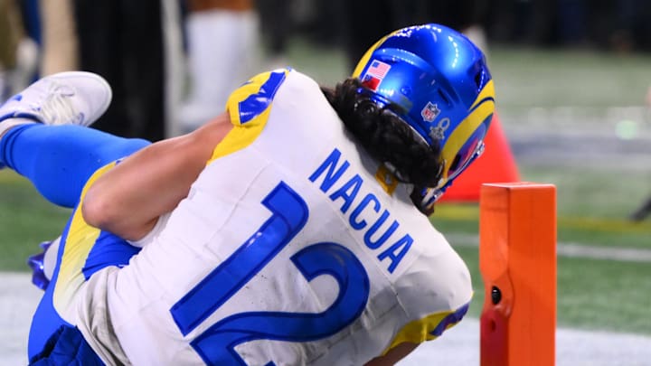 Jan 25, 2026; Seattle, WA, USA; Los Angeles Rams wide receiver Puka Nacua (12) scores a touchdown against the Seattle Seahawks during the second half in the 2026 NFC Championship Game at Lumen Field. Mandatory Credit: Steven Bisig-Imagn Images