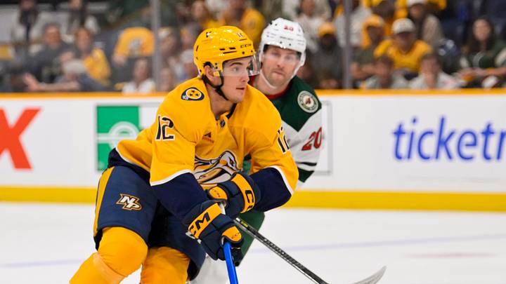 Oct 1, 2026; Nashville, Tennessee, USA;  Nashville Predators defenseman Ryan Ufko (12) skates with the puck against the Minnesota Wild during the first period at Bridgestone Arena.  Mandatory Credit: Steve Roberts-Imagn Images