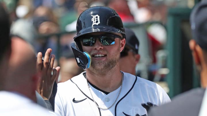 Detroit Tigers left fielder Austin Meadows (17) high-fives teammates 